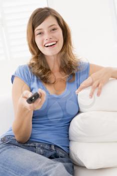 Royalty Free Photo of a Woman With a Remote Control