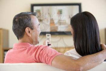 Royalty Free Photo of a Couple Watching Television