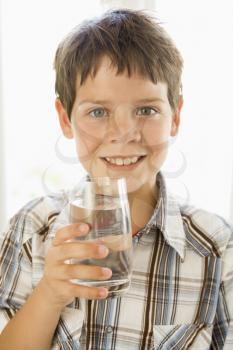 Royalty Free Photo of a Boy With a Glass of Water