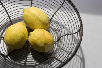 Royalty Free Photo of a Basket of Lemons