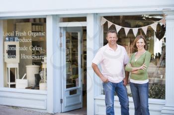 Royalty Free Photo of a Couple in Front of an Organic Food Store