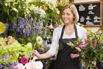 Royalty Free Photo of a Woman Working in a Flower Shop