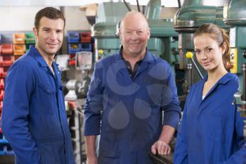 Royalty Free Photo of Three Machinists