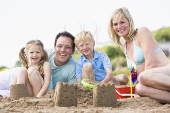 Royalty Free Photo of a Family Making Sand Castles