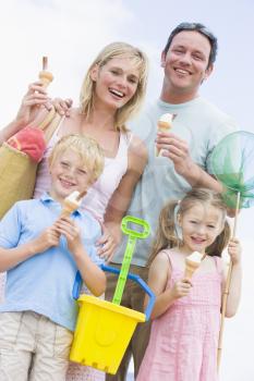 Royalty Free Photo of a Family With Ice Cream at the Beach