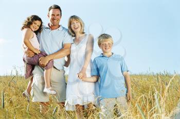 Royalty Free Photo of a Family in a Field