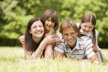 Royalty Free Photo of a Family in the Grass
