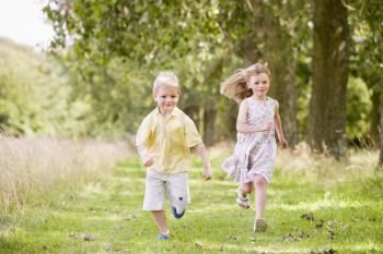 Royalty Free Photo of Children Running Outside