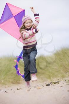 Royalty Free Photo of a Girl Flying a Kite
