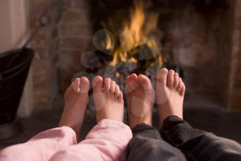 Royalty Free Photo of Children's Feet at a Fire