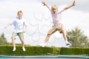 Royalty Free Photo of Two Boys on a Trampoline