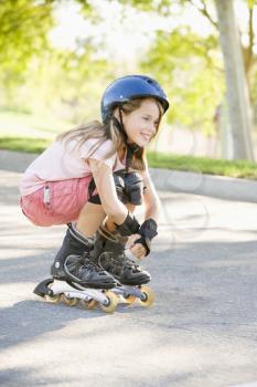 Royalty Free Photo of a Girl on Rollerblades