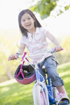 Royalty Free Photo of a Girl on a Bike