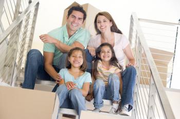 Royalty Free Photo of a Family Sitting on Stairs