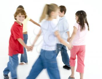 Royalty Free Photo of a Group of Children Playing Ring Around the Rosie