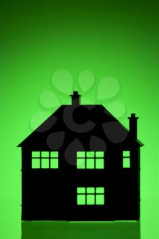 Royalty Free Photo of a House Shape on Green