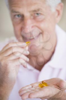 Royalty Free Photo of a Man With Capsules