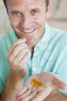 Royalty Free Photo of a Man With Pills