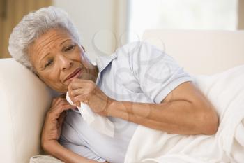 Royalty Free Photo of a Woman Sick on the Couch