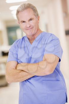 Royalty Free Photo of a Doctor Standing in a Hospital