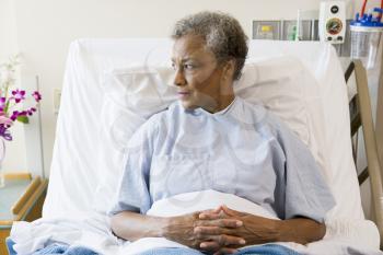Royalty Free Photo of a Woman in a Hospital Bed