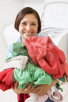 Royalty Free Photo of a Woman With a Pile of Laundry