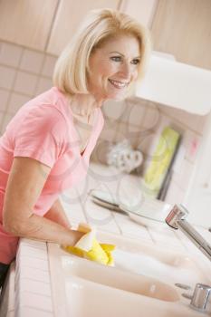 Royalty Free Photo of a Woman Doing Dishes