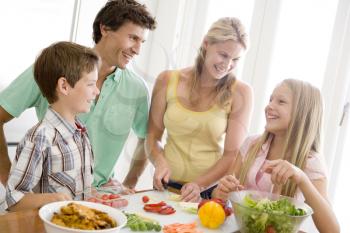 Royalty Free Photo of a Family Preparing Food