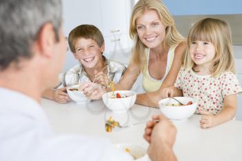 Royalty Free Photo of a Family Having a Meal