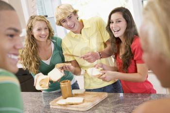 Royalty Free Photo of Teenagers Having Sandwiches