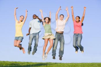 Royalty Free Photo of Teens Jumping