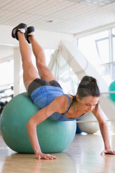 Royalty Free Photo of a Woman Working Out on a Medicine Ball