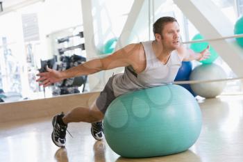 Royalty Free Photo of a Man Working Out on a Swiss Ball