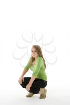 Royalty Free Photo of a Teenage Girl Crouching
