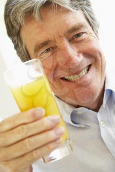 Royalty Free Photo of a Man Drinking Juice