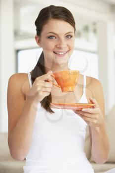 Royalty Free Photo of a Woman With an Orange Teacup