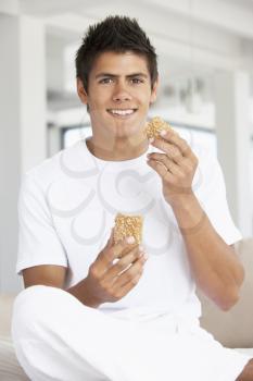 Royalty Free Photo of a Guy With a Brown Bread Roll