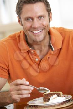 Royalty Free Photo of a Man Eating Pie