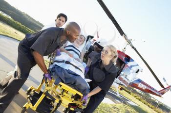 Royalty Free Photo of a Patient Being Taken From an Air Ambulance