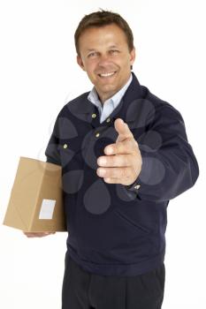 Royalty Free Photo of a Courier With a Parcel Extending His Hand