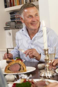 Royalty Free Photo of a Man at a Dinner Party