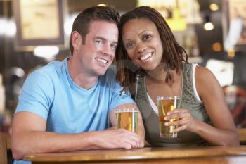 Royalty Free Photo of a Couple Having a Drink in a Bar