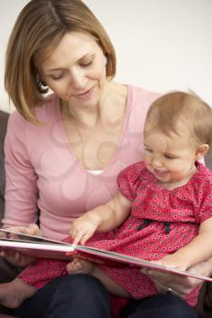 Royalty Free Photo of a Mother Reading to Her Daughter