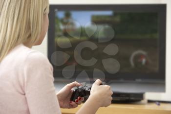 Royalty Free Photo of a Woman Playing Video Games