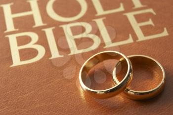 Royalty Free Photo of Wedding Rings on a Bible