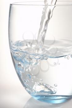 Royalty Free Photo of a Water Being Poured Into a Glass