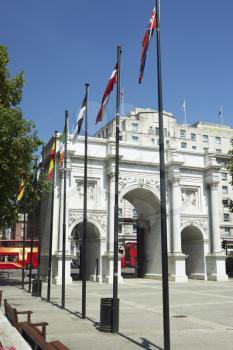 Royalty Free Photo of the Marble Arch With Flags Flying