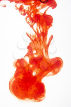 Royalty Free Photo of Red Ink Mixing in Water