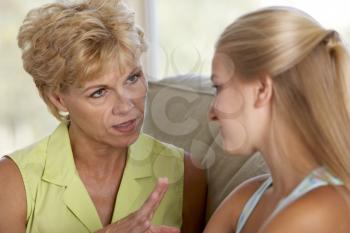 Royalty Free Photo of a Woman Talking to Her Daughter