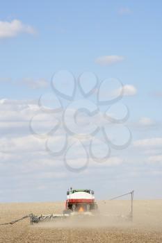 Royalty Free Photo of a Tractor Planting Seed